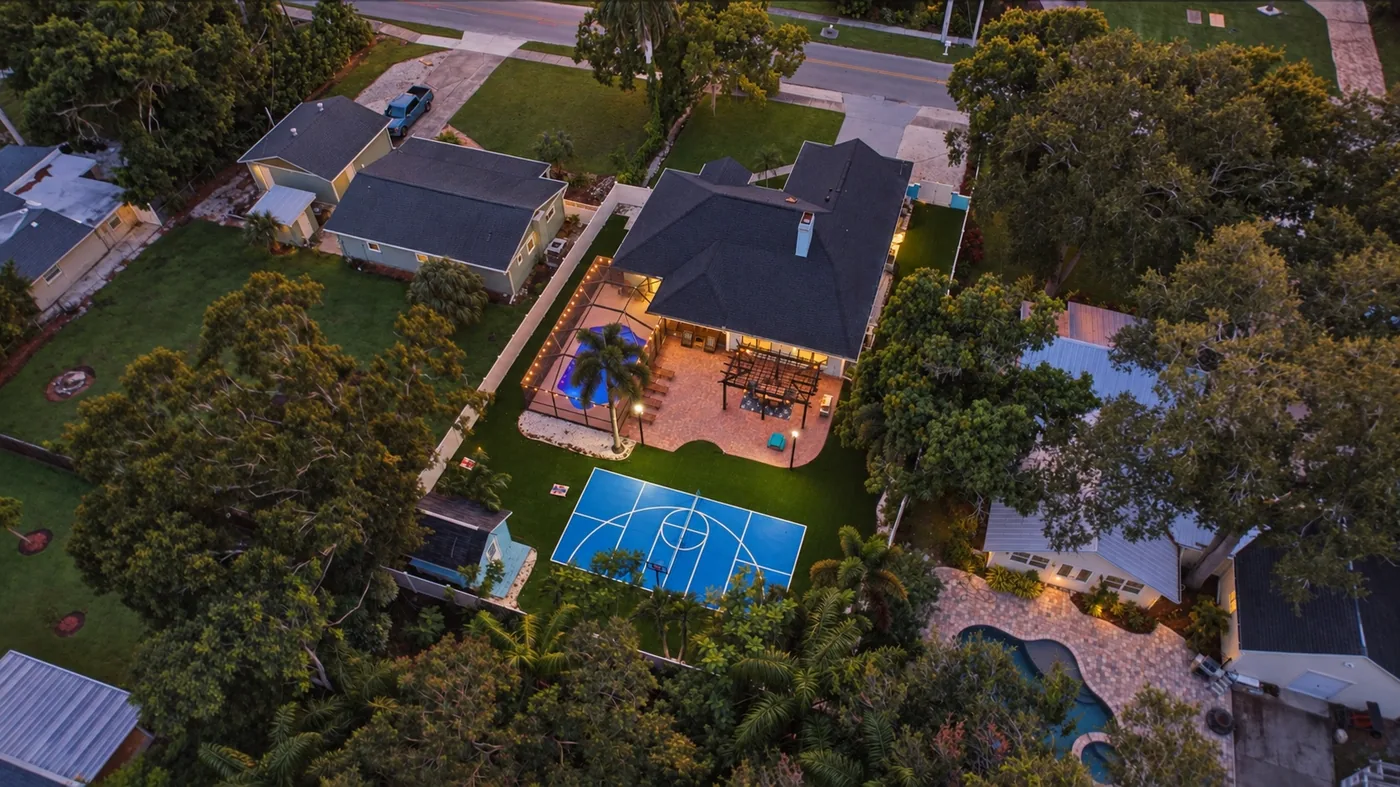 Pickleball Pool Home Retreat — Aerial view of the house, pool and pickleball court