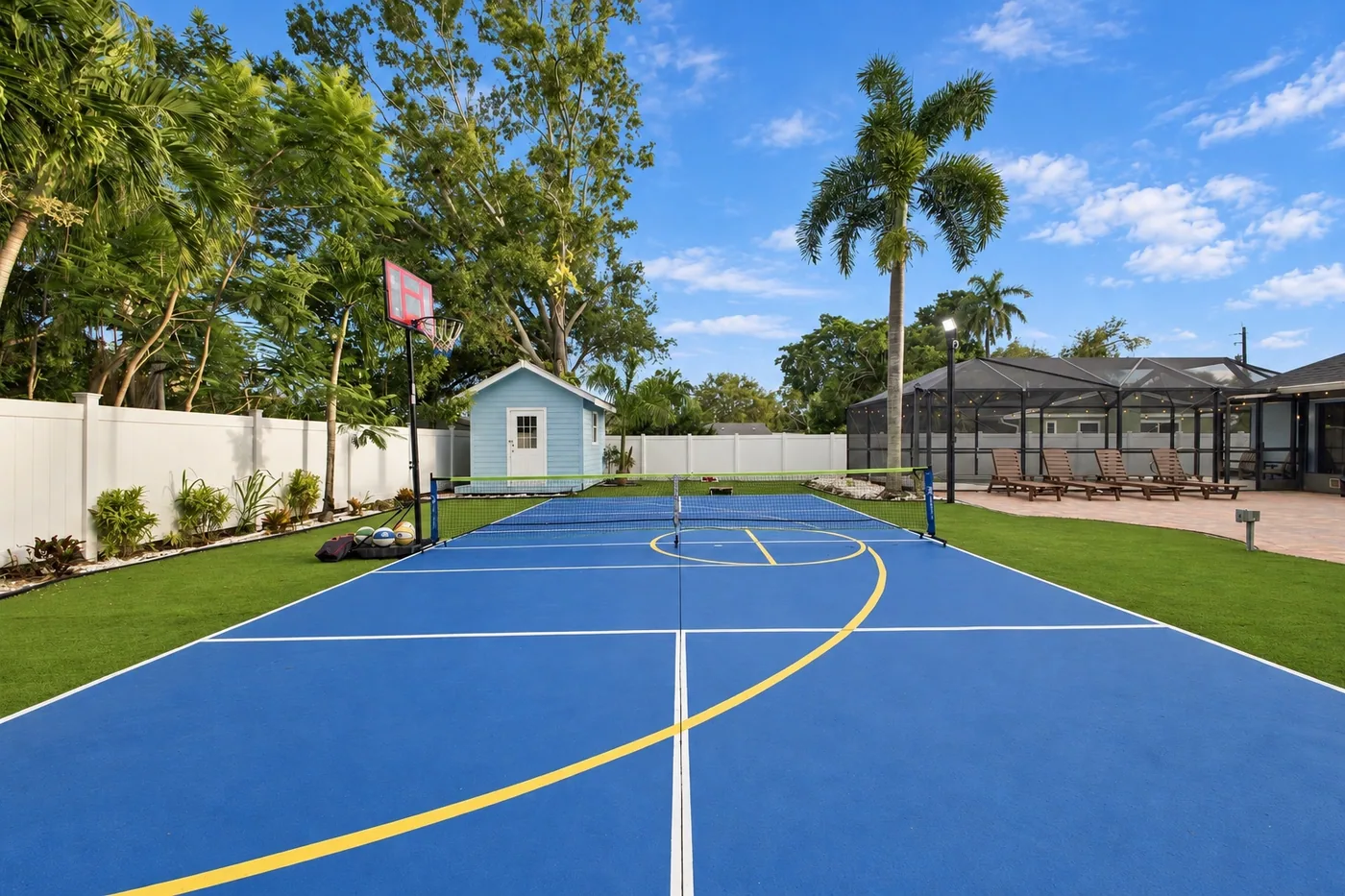 Pickleball Pool Home Retreat — Pickleball court with a portable basketball hoop
