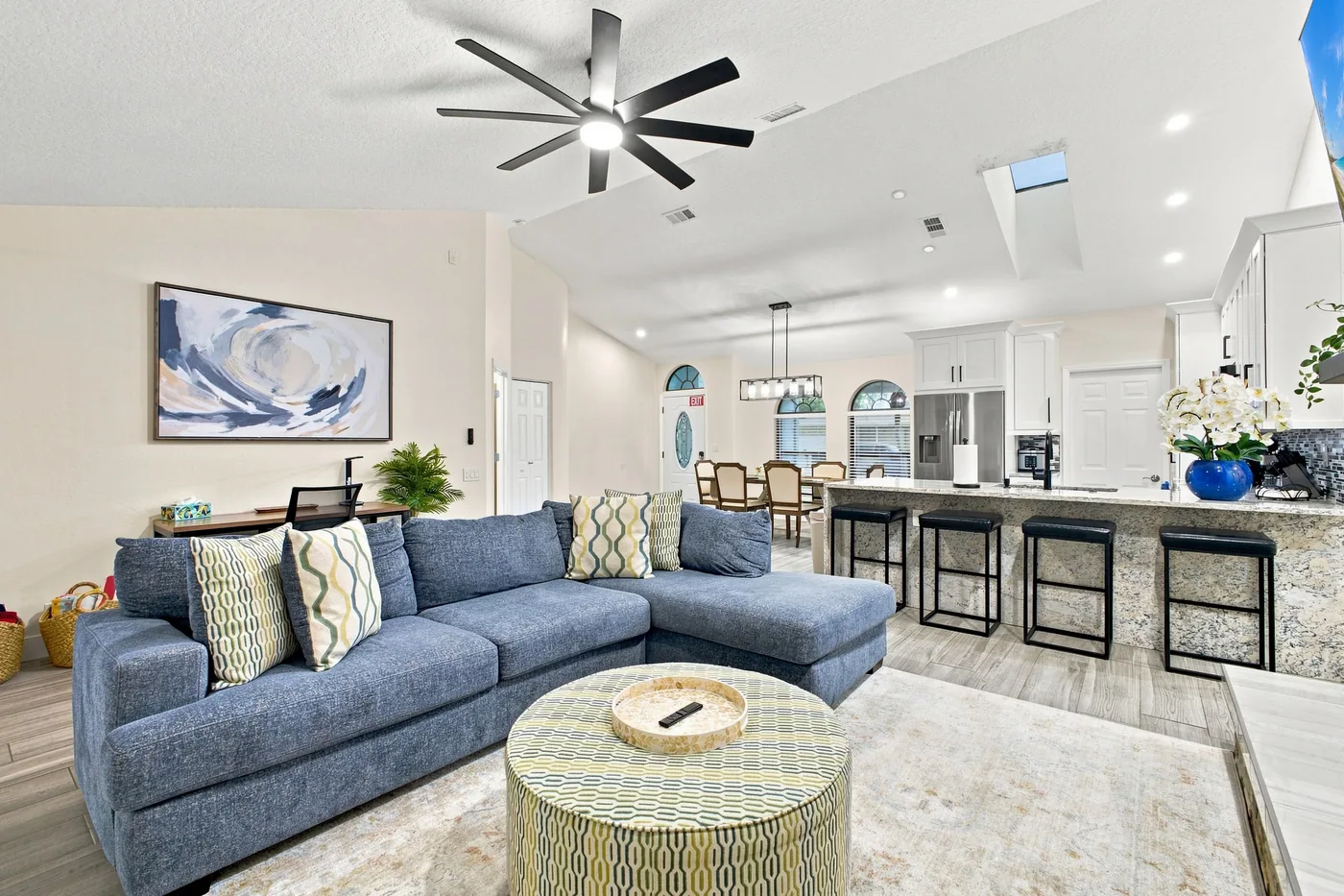 Pickleball Pool Home Retreat — Open living room, kitchen and dining area