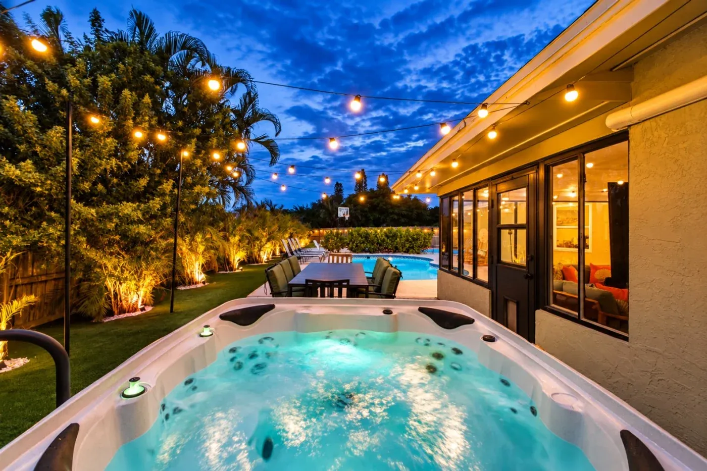 The Coastal — Hot tub beside the outdoor dining patio