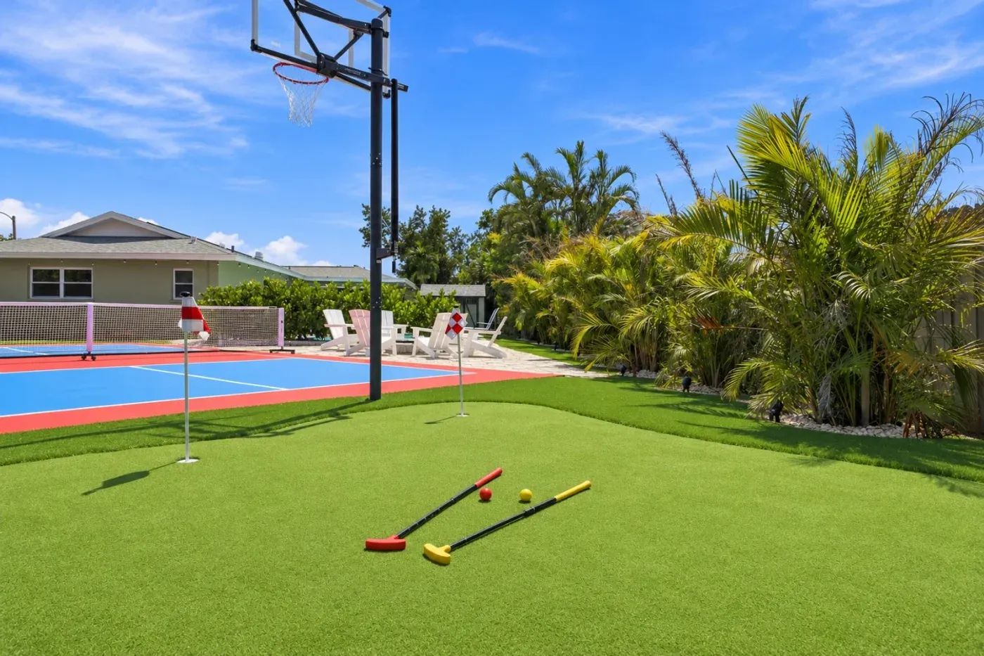 The Coastal — Putting green beside the basketball hoop