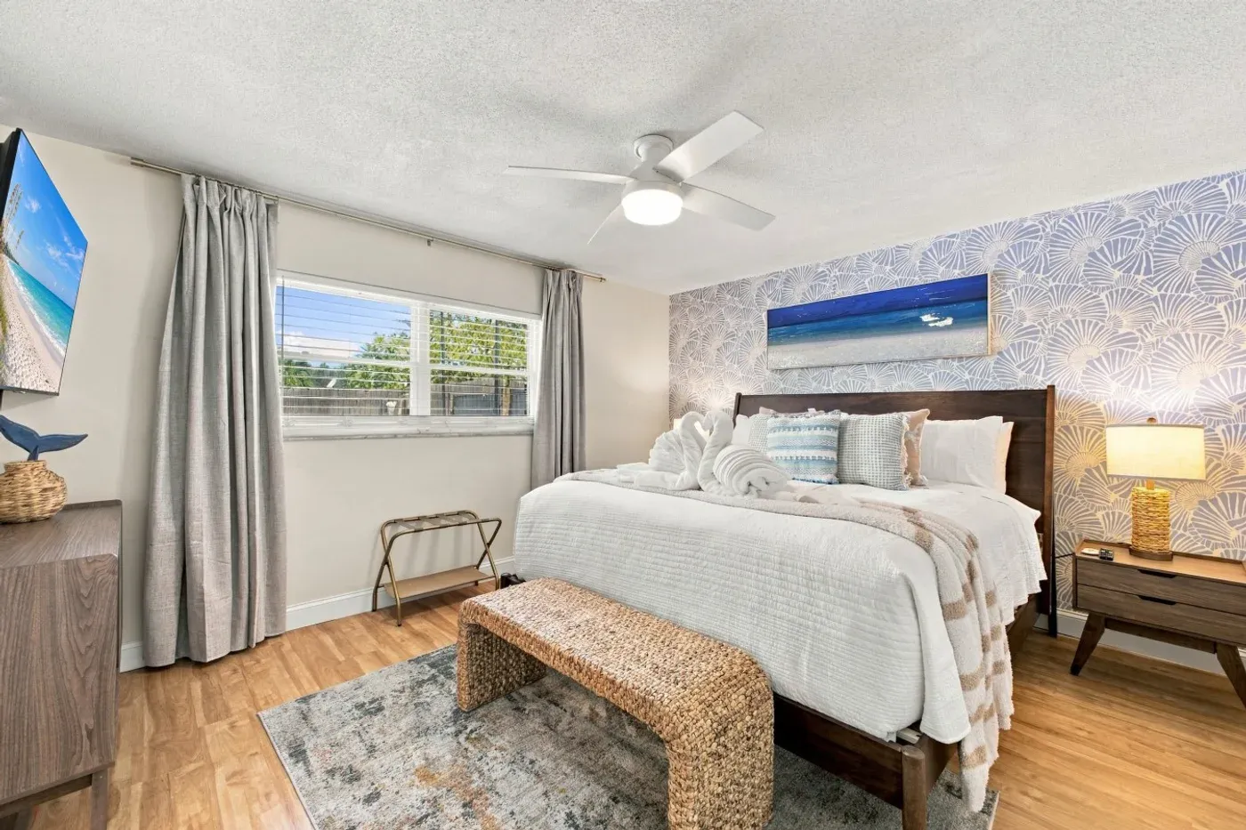 The Coastal — Primary bedroom with king bed