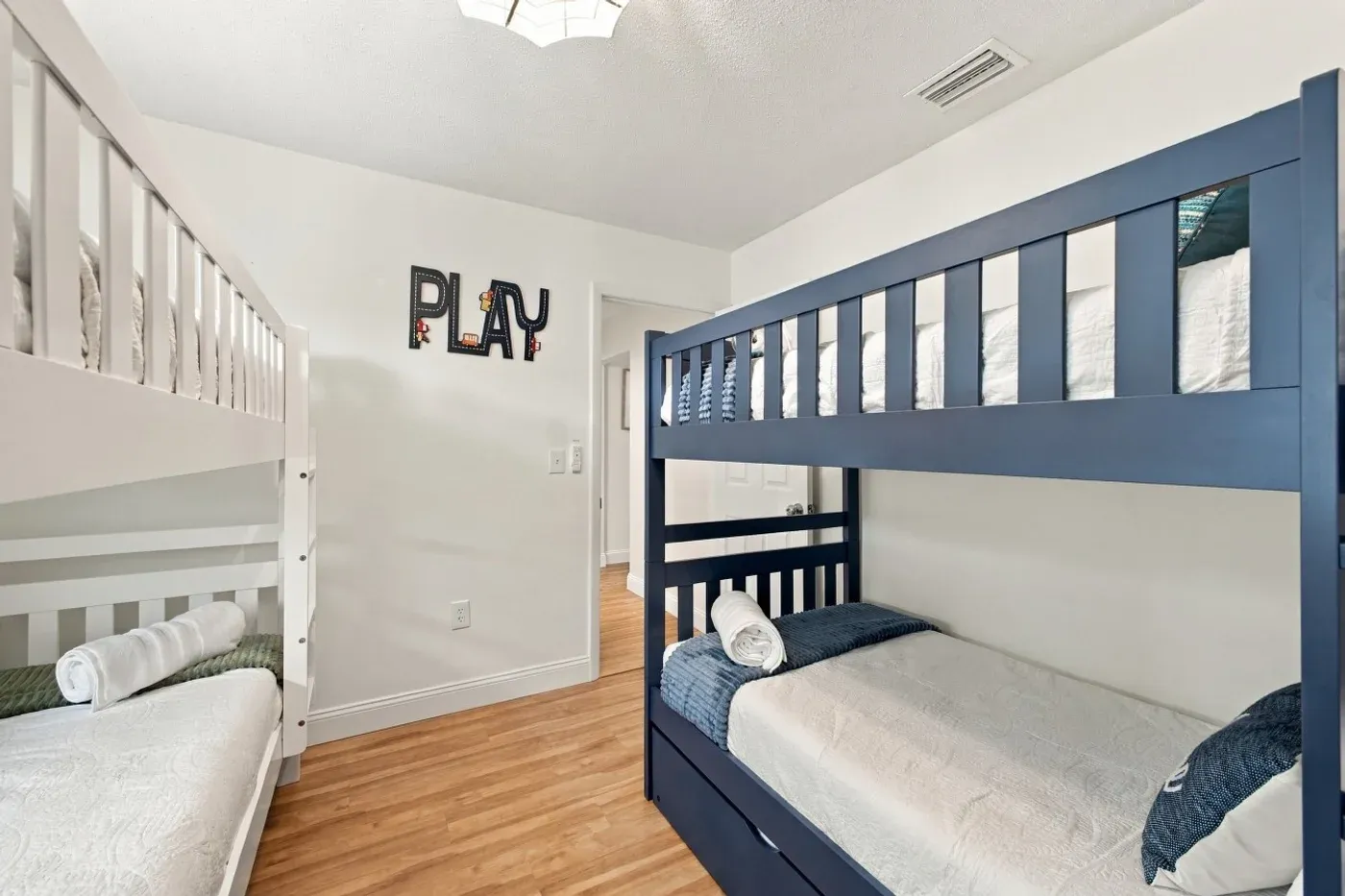 The Coastal — Bedroom 3 with twin bunks